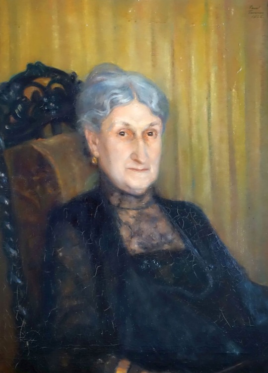 Gmälde von Paul Tanner, portrait einer älteren Dame im schwarzen Kleid im Lehnstuhl vor goldener Tapete